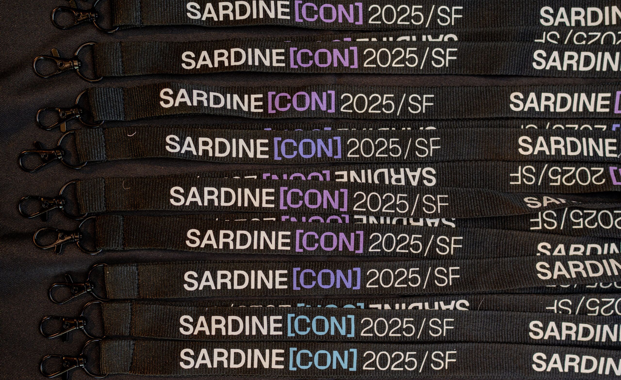 sardine event photography1 scaled 02001a96 Conference photography of custom SardineCon 2025 event badges in San Francisco.