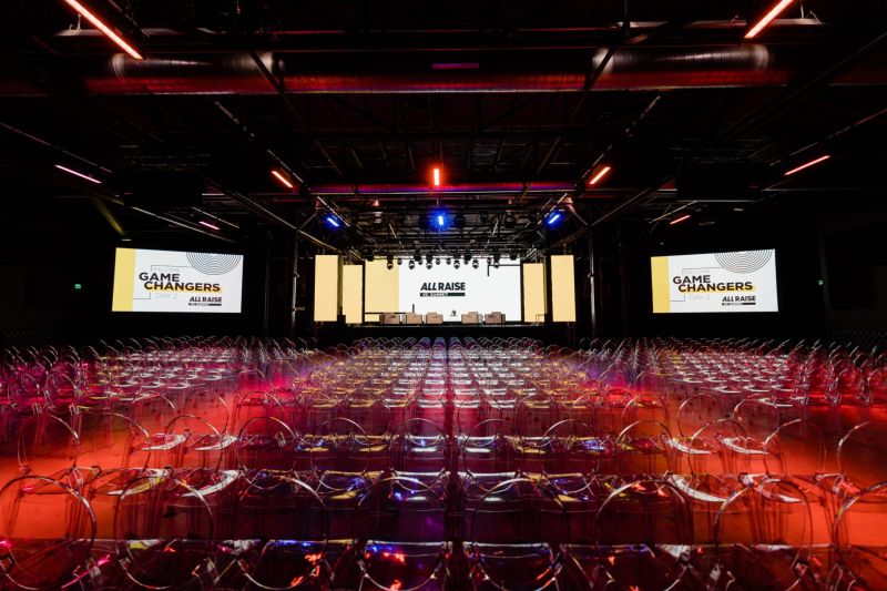 Modern auditorium set up for a corporate event, ready for corporate event video production