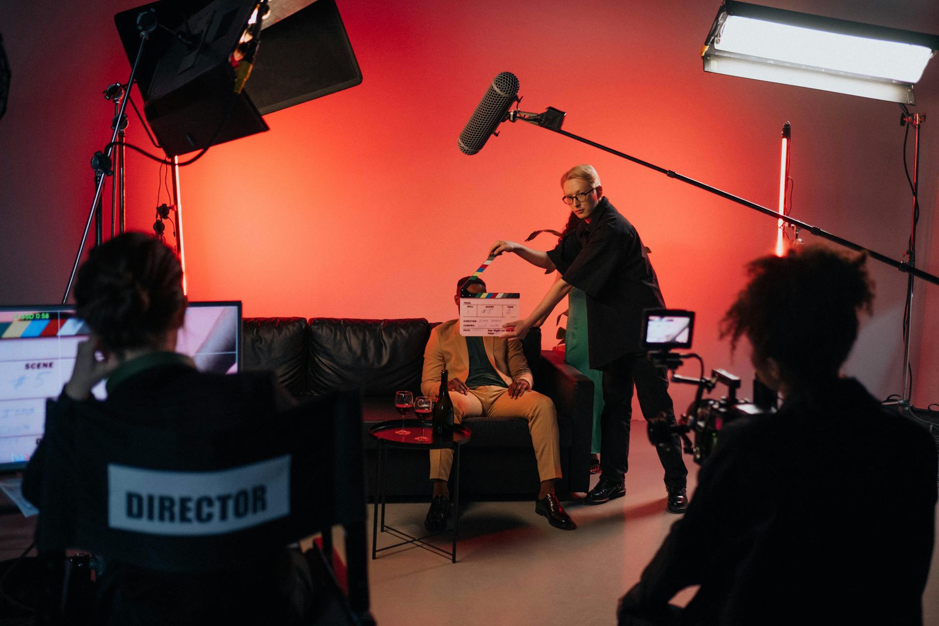 Luma Creative crew filming an interview with a camera, boom microphone and production slate