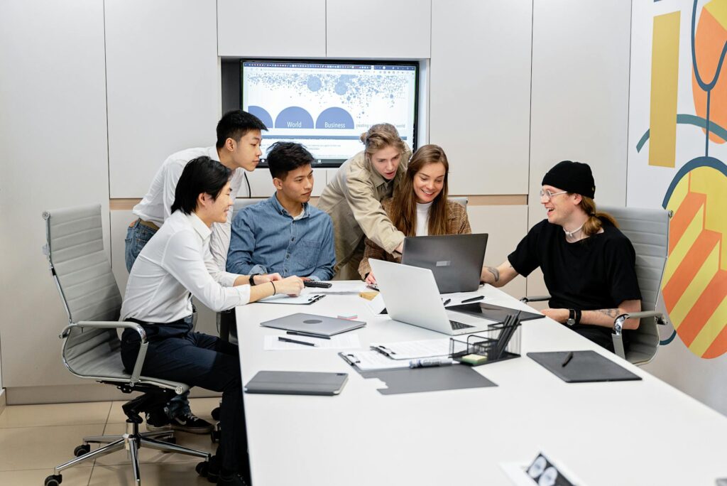 Team brainstorming ideas for behind-the-scenes content in office