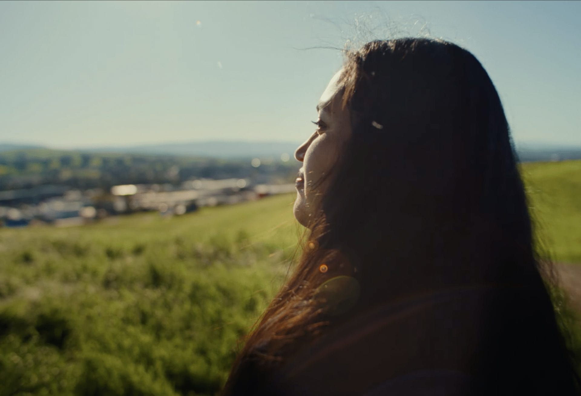 First-generation college student overlooking her school in a nonprofit video produced by Luma Creative for The Reach Foundation.